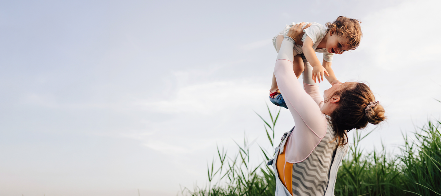 woman lifting her child