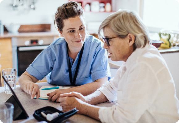 doctor sitting with patient and smiling