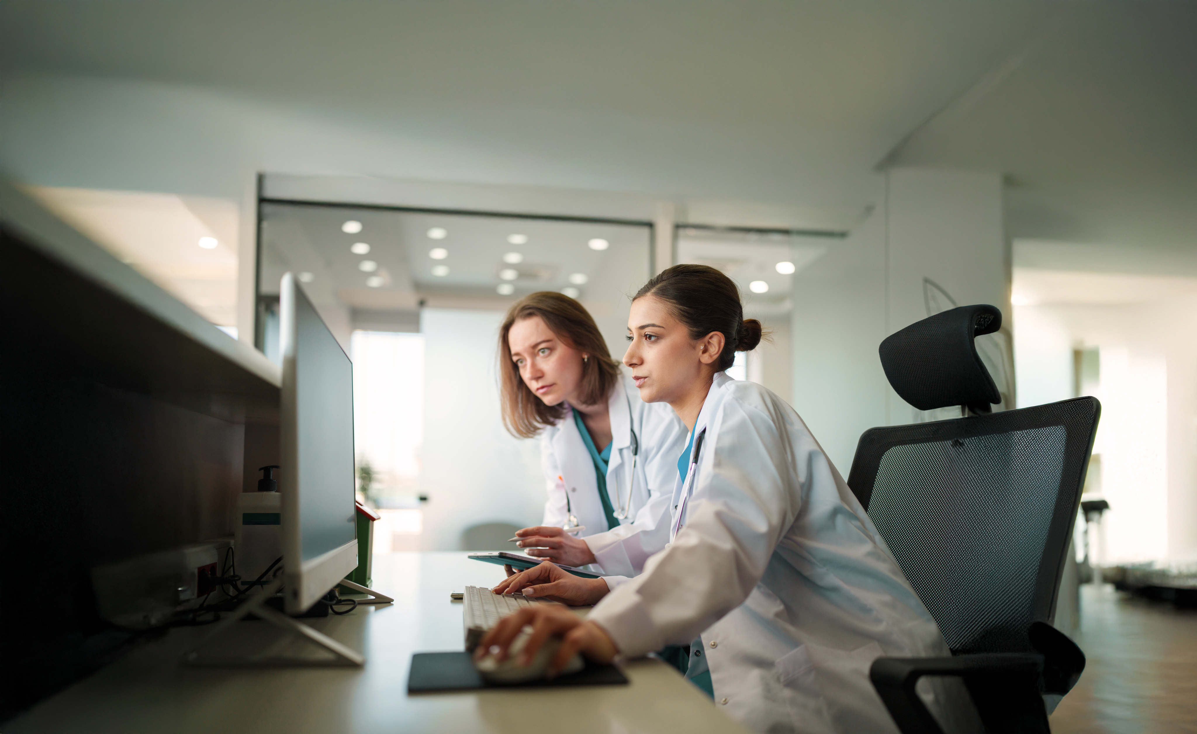 two doctors looking at a computer together