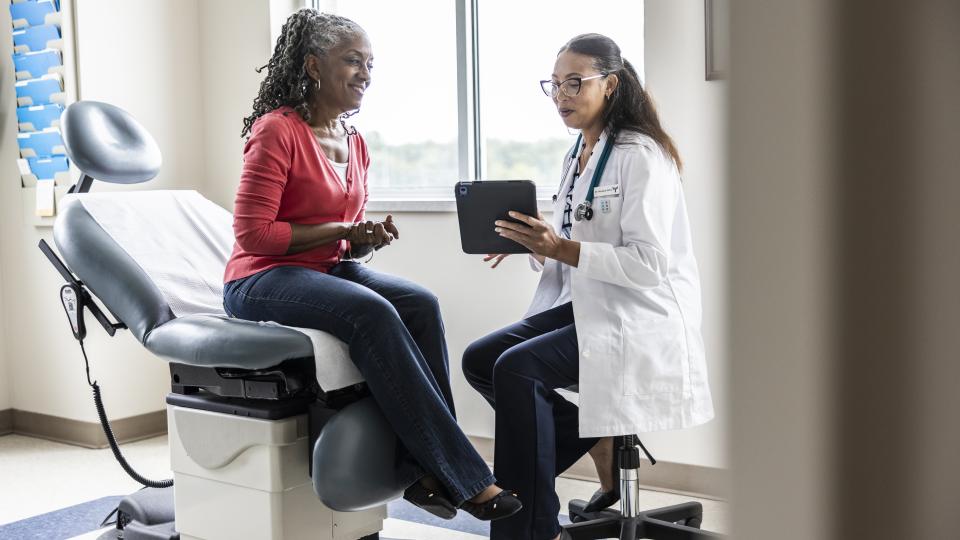 A doctor meets with a patient
