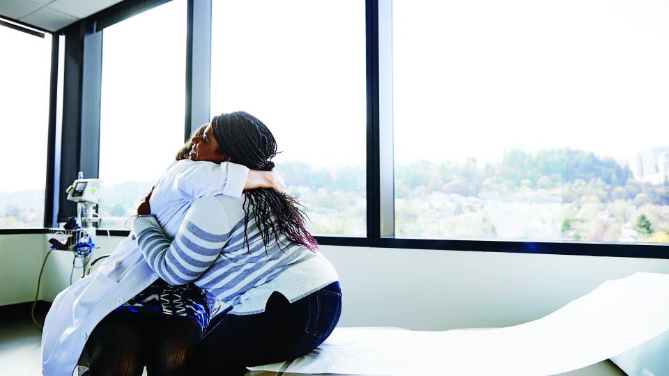 a person hugging another person