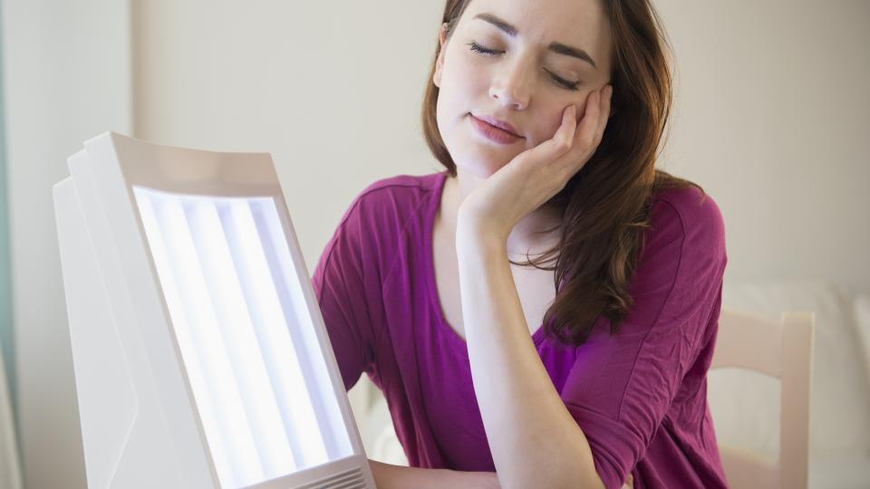 a person sleeping on her hand