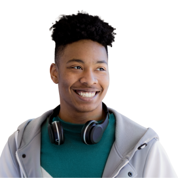 Young man smiling with headphones around neck wearing gray jacket and teal shirt