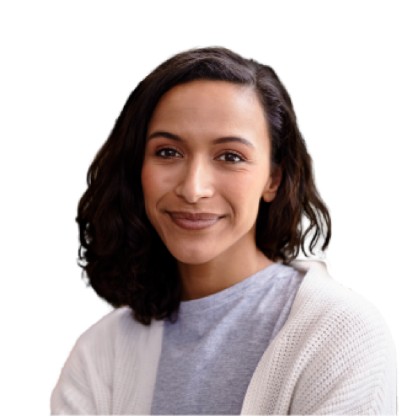 Smiling woman with shoulder-length dark hair wearing a light gray sweater and white cardigan.
