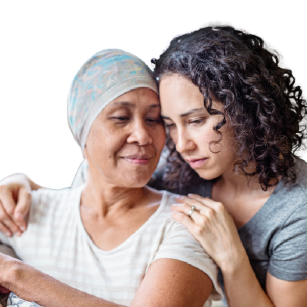Elderly woman in a headscarf embraced by a young adult woman