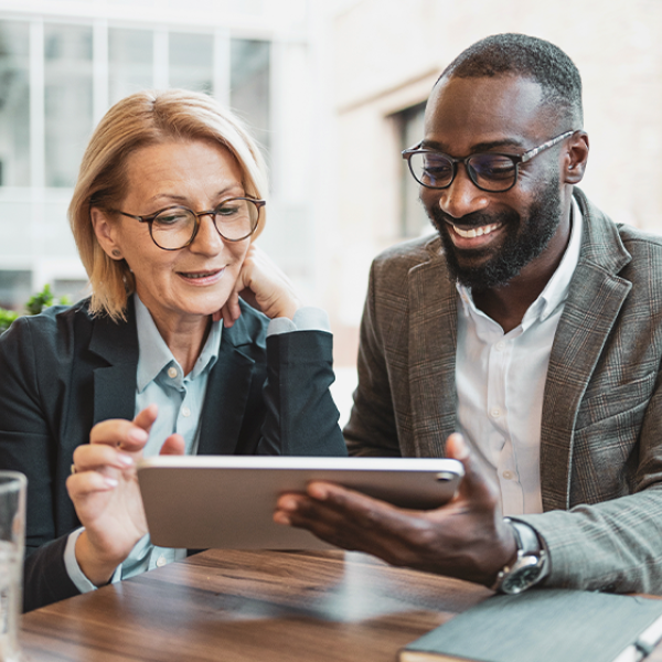 man and woman on tablet