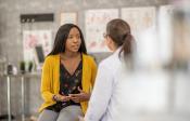 Patient discusses her care with a clinician