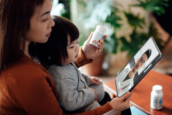 woman and baby on video call with doctor