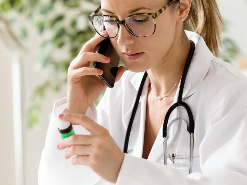 A physician has a phone conversation discussing a medication