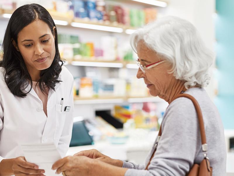 Independent Pharmacist with customer