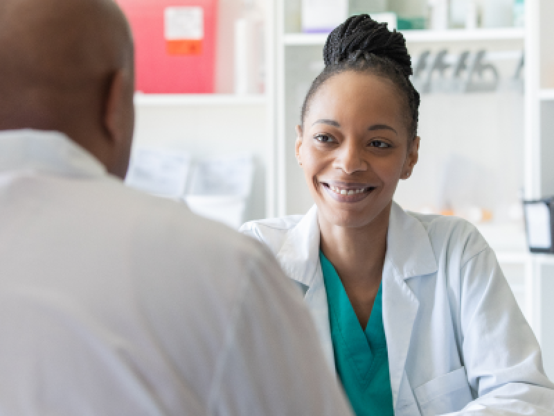 Doctor helps patient
