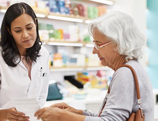 Independent Pharmacist with customer
